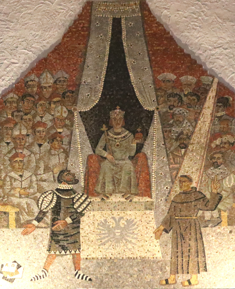 Walter Eglin: Martin Luther (rechts) und der Offizial des Bischofs von Trier, Johann von der Ecken, der Luther verhörte (links) vor König Karl V. beim Reichstag im Bischofshof in Worms, Mosaik, um 1959, in der Dreifaltigkeitskirche in Worms